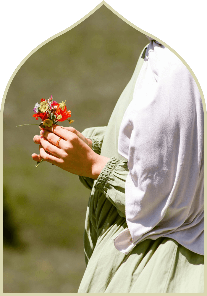 muslim woman holding a flower